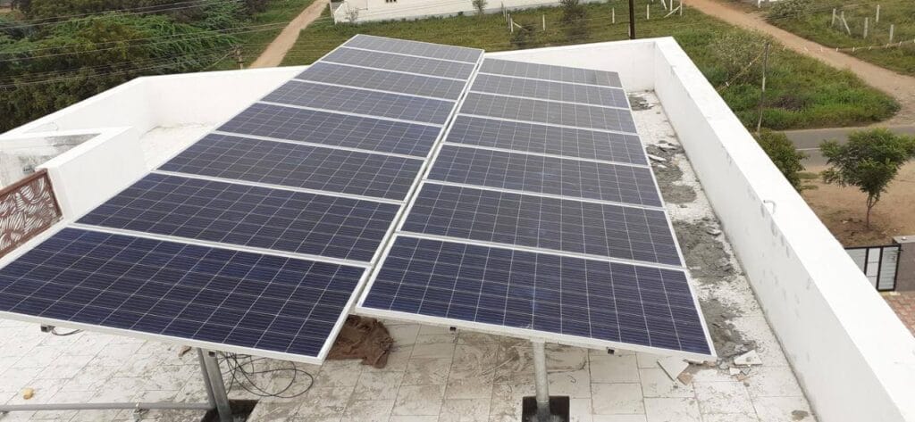 1. Elevated 5kW solar panel setup at Vellakovil rooftop